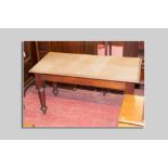 A Victorian scratch top oak scullery table with falling chamfered top, large block frame and