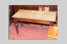 A Victorian scratch top oak scullery table with falling chamfered top, large block frame and