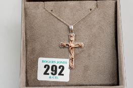 A silver neck chain with a Clogau gold mounted silver crucifix, crucifix 3.5 gms, crucifix and chain