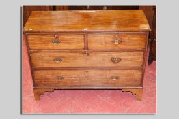 A 19th Century mahogany chest of two long and two short drawers with brass drop handles, 122 cms