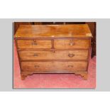 A 19th Century mahogany chest of two long and two short drawers with brass drop handles, 122 cms
