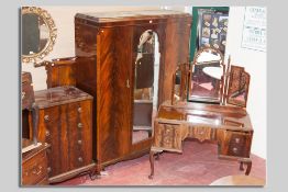 A good quality early 1900s mahogany bedroom suite with painted grain highlighting and multi-wood