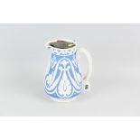 A Copeland blue ground semi-glazed narrow neck jug with raised Gothic style pattern, scrolled handle