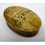 A horn lidded snuff-box of oval form with sgraffito writing to the lid as follows 'HH CAUA Gwnion