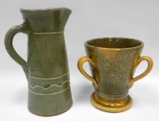 EWENNY POTTERY - glazed tyg incised 'Cariad cwpan fel yn 1670' on spreading foot with three handles,