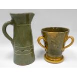 EWENNY POTTERY - glazed tyg incised 'Cariad cwpan fel yn 1670' on spreading foot with three handles,