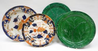 A mixed lot of Cambrian pottery plates including impressed mark SWANSEA green leaf example,