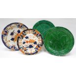 A mixed lot of Cambrian pottery plates including impressed mark SWANSEA green leaf example,