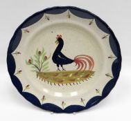 LLANELLY POTTERY - rare 'Cockerel' plate having a slightly wavy rim, the painted single black