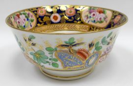 SWANSEA porcelain - a footed tea bowl with tapering body and flanged foot-rim, decorated and