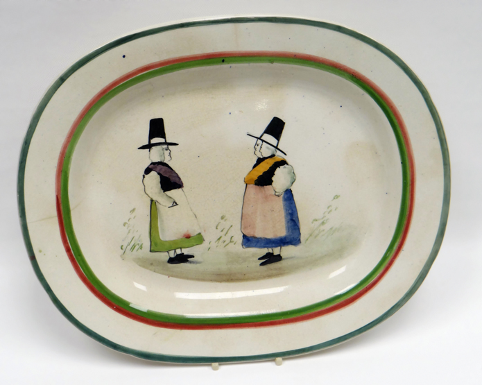 LLANELLY POTTERY - oval meat platter hand-painted with two confronting female figures in folk