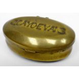 A brass oval snuff box with hinged lid impressed 'J CAYO EVANS', 2.75ins long (7cms), the name is
