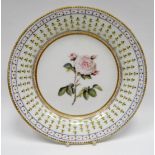 NANTGARW porcelain - circular plate of plain form, probably London painted with centre rose stem and