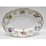 NANTGARW porcelain - oval dish of alternating lobed form with a floral moulded border, with