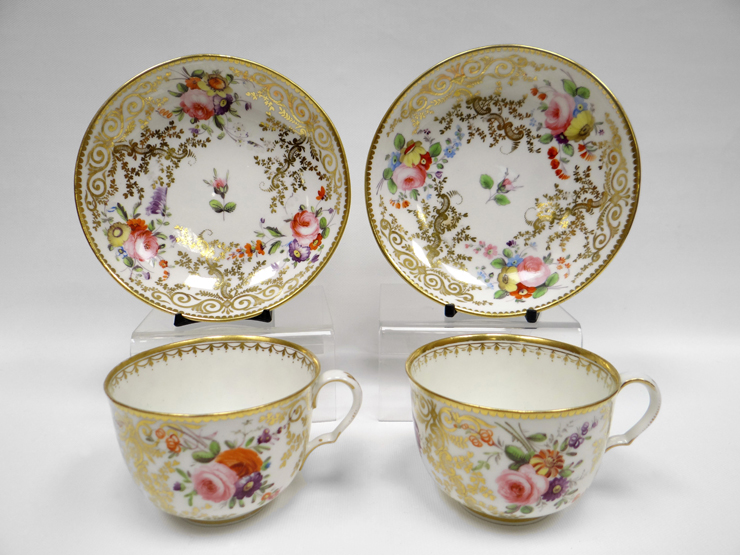 SWANSEA porcelain - pair of tea cups and saucers, the cups with ear shaped loop handles, with all