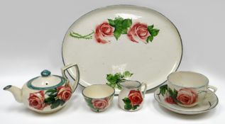 LLANELLY POTTERY - five piece cabaret-size tea-service, comprising oval tray, teapot, cream jug, cup