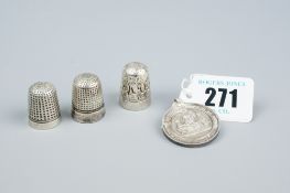 A cased silver Eisteddfodic medal and three Dorcas white metal thimbles