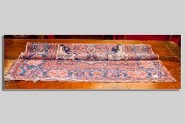 An antique Persian rug with geometric central design and wide floral border, 190 x 120 cms approx (
