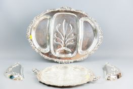 A large oval electroplated turkey platter with scrolled border and with end half moon recesses