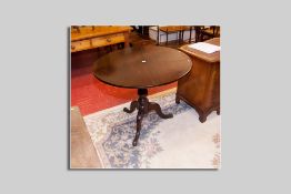 A good antique mahogany tilt top tripod table with turned bulbous column, 76 cms high, 93 cms diam