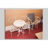 A painted cast iron tripod garden/pub table with circular white marble top and a pair of  metal