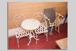 A painted cast iron tripod garden/pub table with circular white marble top and a pair of  metal