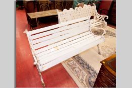A 19th Century white painted cast iron, possibly Coalbrookdale, garden bench, the back of six oval
