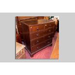 A 19th Century oak and crossbanded chest of three long and two short drawers all with turned