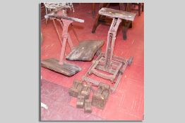 A set of iron based potato scales by Avery on iron wheels and five iron block weights