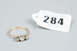 A nine carat gold three stone diamond ring, 1.6 grms