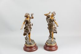 A pair of Paris bronze patinated spelter figures of young maidens in flowing robes, titled 'L'