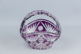 A cut glass purple overlaid hobnail cut basket, 25 cms wide, 24 cms high