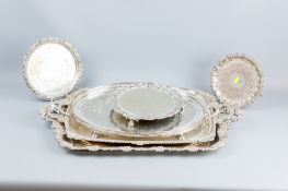 Two large oblong electroplated twin handled trays, an oval electroplated bright cut galleried tray