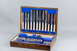 A forty two piece oak canteen of electroplated cutlery, the knives with bone handles