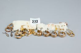 A large parcel of gold, white metal and silver earrings and precious stone earrings, total 30 grms