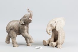 A matt glazed African elephant porcelain calf by Brookes & Bentley, 1991 and an Asian elephant