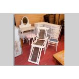 A white painted cane backed and cane seated folding steamer chair, a pair of white painted single