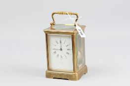 A late 19th Century brass cased carriage clock with eight day movement repeating on a blued steel