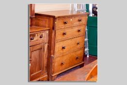 A 19th Century oak chest of two short over three long drawers with panel sides on bracket feet,