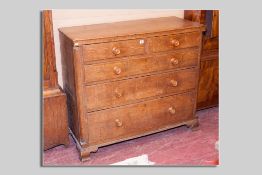 A Victorian oak chest of two short over three long drawers, rounded pillar decoration on shaped