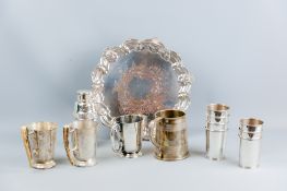 A circular electroplated tray with shell and wavy border, a one quart electroplated tankard with '