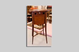An Edwardian mahogany and crossbanded tea stand having a shaped square top with four drop down