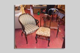 An Edwardian mahogany and inlaid occasional chair, a mahogany elbow chair with garland and