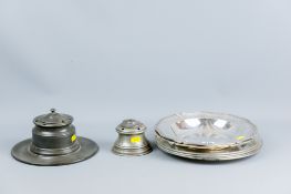 A pair of crested electroplated circular dishes with wavy line borders, a parcel of four circular