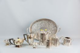 An oval galleried twin handled tray with a four piece bright cut electroplated tea and coffee