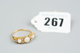 An eighteen carat gold opal and diamond dress ring having a centre circular cut opal with two