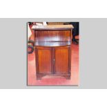 An Edwardian mahogany and crossbanded open top bookcase with two cupboards below