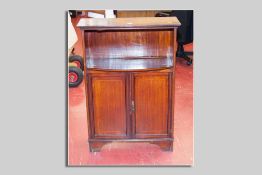 An Edwardian mahogany and crossbanded open top bookcase with two cupboards below