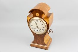 An Edwardian inlaid mahogany mantel clock, cylinder shaped top above Sheraton fans, waisted body