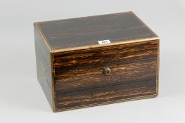 A coromandel and brass jewellery box having interior compartments with removable tray, end inset